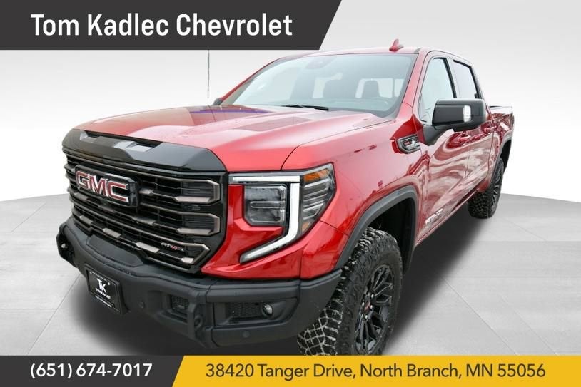 2023 GMC Sierra 1500 AT4X in Volcanic Red Tintcoat — front three-quarter view